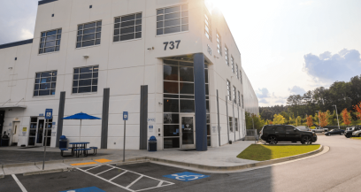 Exterior of a Airsun Express Logistics cold storage facility in Atlanta, Georgia, showcasing modern architecture and accessibility under a bright afternoon sun.