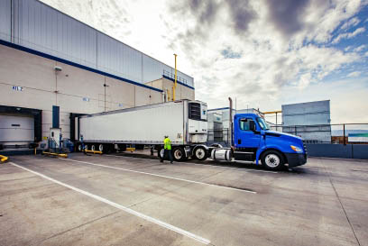 A Airsun Express branded trailer is parked at a cold storage warehouse