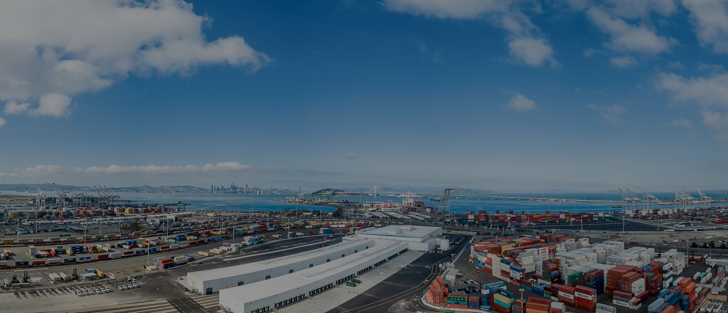 View of shipping port with Airsun Express cold storage facilities and fleet of temperature-controlled trucks.