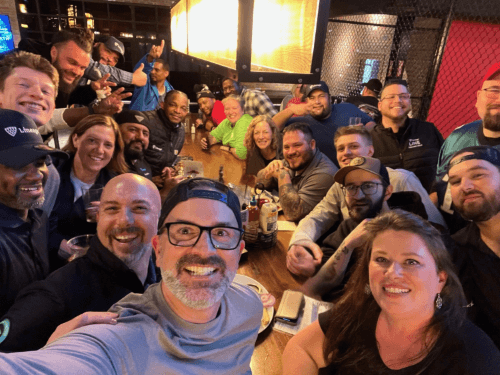 Airsun Express EDGE Program participants enjoying a social gathering at a lively restaurant, fostering camaraderie and connections outside of the workplace.