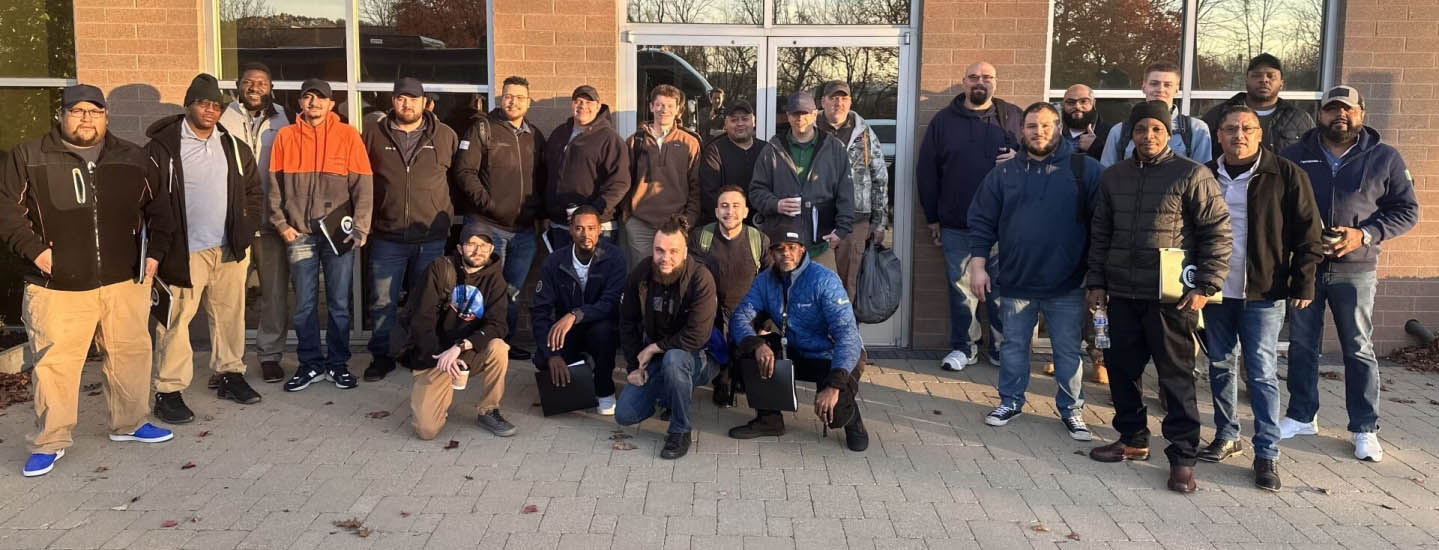 Group photo of Cohort 3 participants in the Airsun Express EDGE Program, gathered outdoors in front of a building, showcasing teamwork and leadership growth.