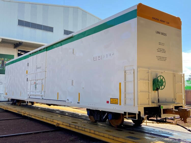 A Airsun Express branded refrigerated railcar on tracks, showcasing their sustainable rail solutions for long-distance food transportation as part of the cold chain logistics.