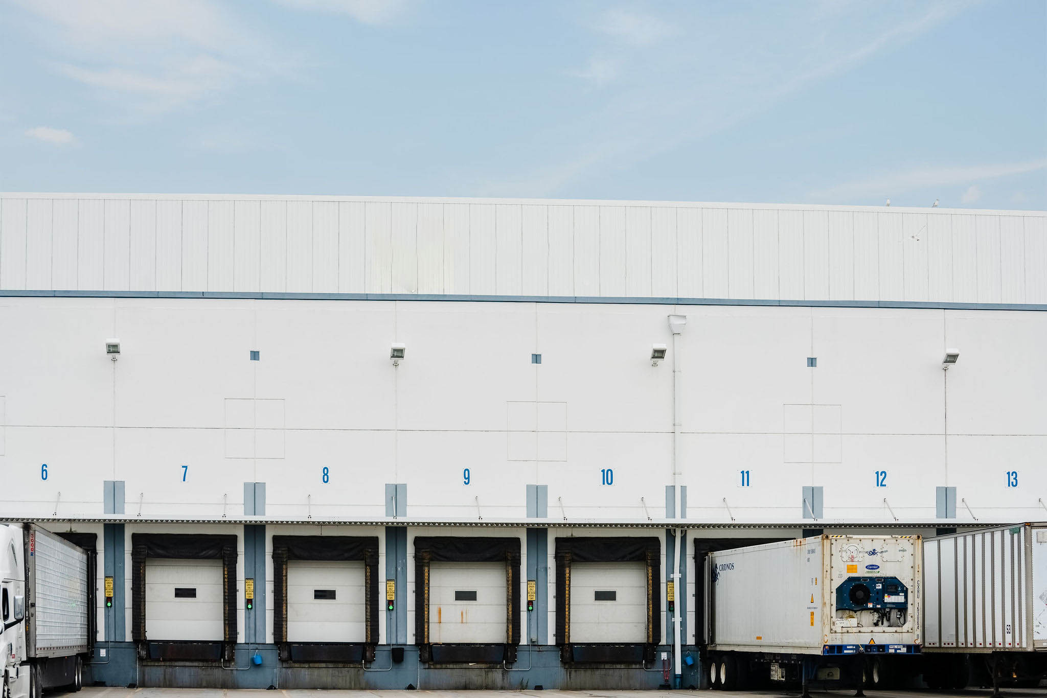 Exterior of Airsun Express warehouse loading docks with trucks