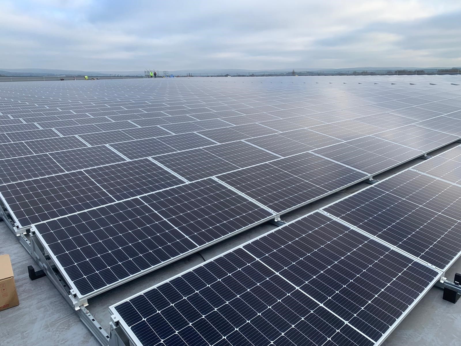 Airsun Express cold storage warehouse facility with array of solar panels.