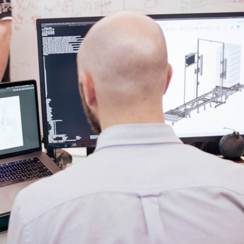 Airsun Express employee looking at computer screens